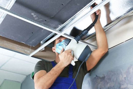 one person from housekeeping service is cleaning duct